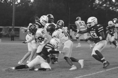The Mamou defense converges to make a stop against a Church Point runner in the Green Demons’ 46-26 home loss to begin district play. (Gazette photo by Sylis Manuel)