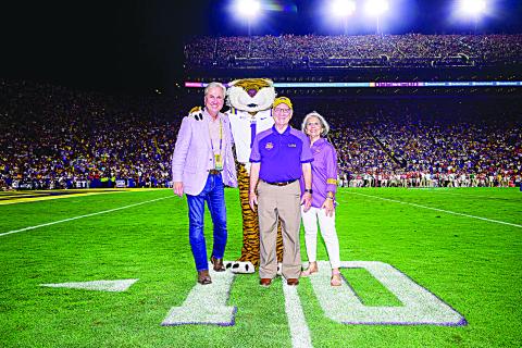 [L-R]: LSU President Wade Rousse, Mike the Tiger, Paul Coreil, Arlene Coreil. (Photo by LSU Athletics)