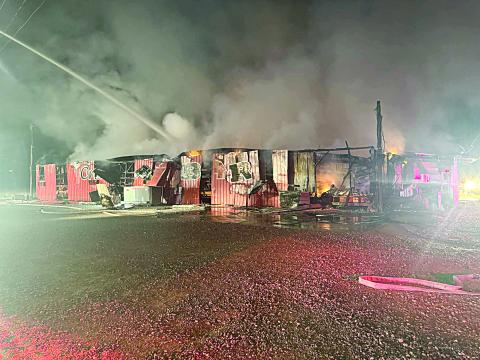 (Left photo) Firefighters work to put out the fire at The Crawfish Barn shortly after midnight on Saturday, January 25. (Photo courtesy of Jeffrey Veillon and by Ty Soileau)