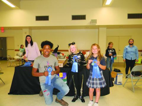 From left, are Jordan Edwards, Aubrey LaHaye and Emy Figueredo, winners in the Rice Cookery divisions.