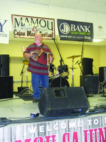MUSICIAN IS HONORED - On September 17, Don Fontenot, of Don Fontenot and Les Amis de la Louisiane, was the special honoree during this year’s Mamou Cajun Music Festival. Fontenot is pictured here as he performs during the event. (Gazette photo by Heather Bogard)