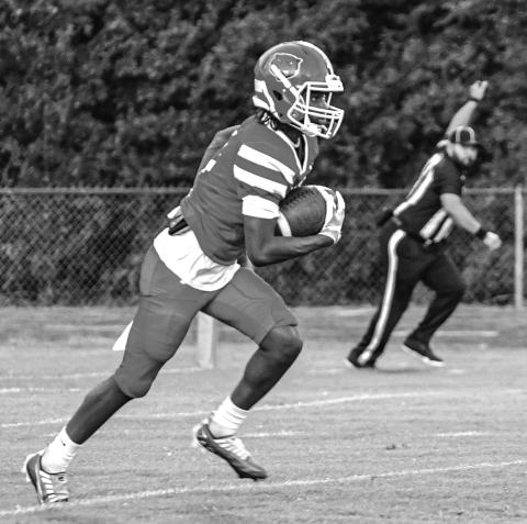 KICK-OFF RETURN - Marcus Evans takes the opening kickoff on his way to a 91-yard scoring gallop. (Photo by Tonya Ortego)