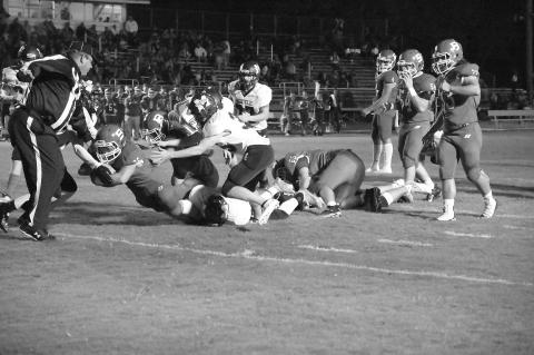 Ashton Deaville (26) dives across the goal line for Basile touchdown in the Bearcats’ homecoming win against Merryville that gave them at least a share of the district championship. (Photo courtesy of Tonya Ortego)