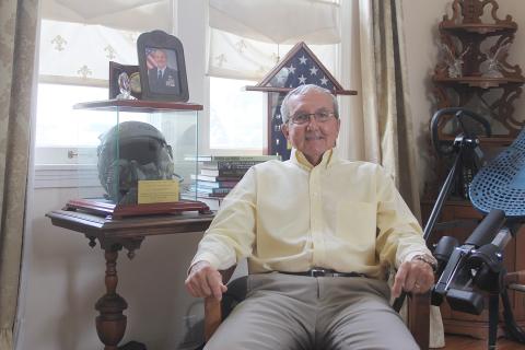 Ben Soileau is pictured sitting in his home office along side items collected during his career in the Air Force. (Gazette photo by Tony Marks)