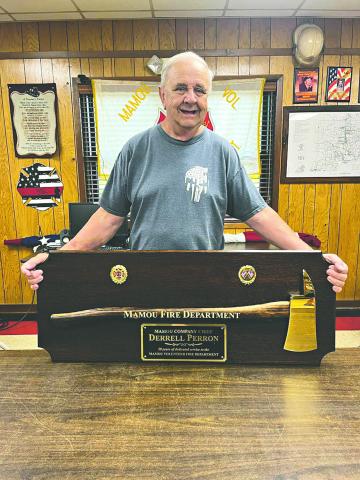 Derrell Perron is pictured with his award commemorating his 50 years of service to the Mamou Fire Department. (Photo courtesy of Mamou Fire Department)
