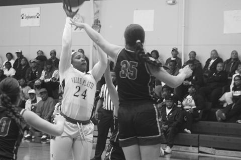 Derriell Freeman (24) attempts a basket for the Lady Bulldogs in their overtime win against Doyle on Monday night. With the win, Ville Platte advanced to the quarterfinals for the first time in 9 years. (Gazette photo by Tony Marks)