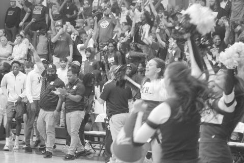 Members of the Mamou coaching staff and cheerleading squad, as well as other member of the Mamou community, celebrate after the Mamou Green Demons advanced to the state semifinals. With the win, the team moved on to play Marksville on Wednesday, March 11, at Burton Coliseum in Lake Charles. (Gazette photo by Tony Marks)
