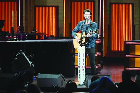 James Dupre is pictured as he makes his debut inside the “Sacred Circle” on stage of the Grand Ole Opry House. Dupre became the second native of Evangeline Parish to perform on the stage after Jimmy C. Newman. (Photo courtesy of Chris Hollo/ The Grand Ole Opry)