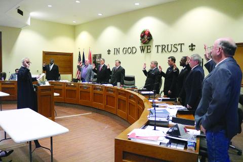 Judge Gary Ortego, of the Third Circuit Court of Appeal, (left) administers the oath of office to the Evangeline Parish Police Jurors. From left are Daniel Arvie, District 9; Keith Saucier, District 1; Kevin Veillon, District 5; Bryan Vidrine, District 7; Tim Causey, District 4; Ryan Ardoin, District 3; Darion Arvie, District 8; Brent Guillory, District 6; and Sidney Fontenot, District 2. (Gazette photo by Tony Marks)