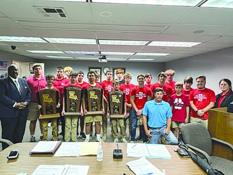 Members of the Basile wrestling team are pictured with Superintendent Darwan Lazard, Evangeline Parish School Board member Nick Chaumont, and Principal Helena Francois. From right are Coach Ben Bertrand, Parker Fontenot, John Wesley Sonnier, Luc Johnson, Pierson Comeaux, Brevan Fields, Tucker Leblanc, Cooper Berzas, Andre Johnson, Jayden Guillory, Jackson Courville, Drew Soileau, Cayden Luben, Austin Ashford, Logan Bergeron, William Ashford, Emery “Gumbo” Lejeune, Daniel Carter, and Scott Berzas. 