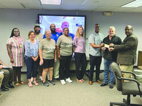 ROTARY OF VILLE PLATTE PRESENTS DONATION TO SPECIAL OLYMPICS - From left are: back row- Jorie Randle and Keith Scott; front row- Monette Doucet, Kelli LaFleur, Wanda Verrette, Dot Doulet, Nicole Johnson, Tommy Jones, Rotary Club of Ville Platte President-Elect Larry Lachney, and Superintendent of Schools Darwan Lazard. (Gazette photo by Tony Marks)