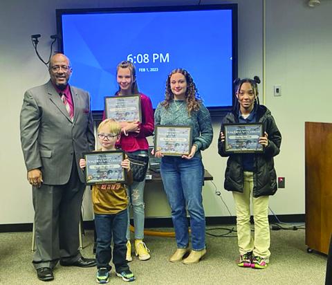 Evangeline Parish Superintendent Darwan Lazard (left) is pictured with talented art students. Pictured from left in the back are Adysen West, Mallory Manuel, and Paisely Ben. Pictured in the front is Gauge Chaffin. Not pictured are Macie Campbell, Trinity Williams, Pasey Sharp, and Madelyn Fontenot. (Gazette photo by Tony Marks)