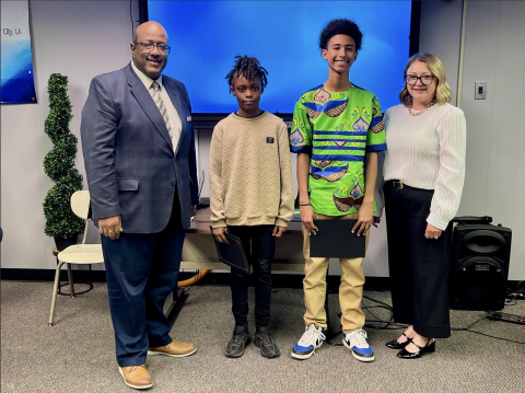 From left are Superintendent Darwan Lazard; Jaiden Thomas, 5th grade student of the year from James Stephens Montessori; Ethan Zang, 8th grade student of the year from Evangeline Reimagine Academy; and Supervisor Cheri Fontenot. Not present was Charlee Smith, 12th grade student of the year from Basile High School. (Gazette photo by Nancy Duplechain)
