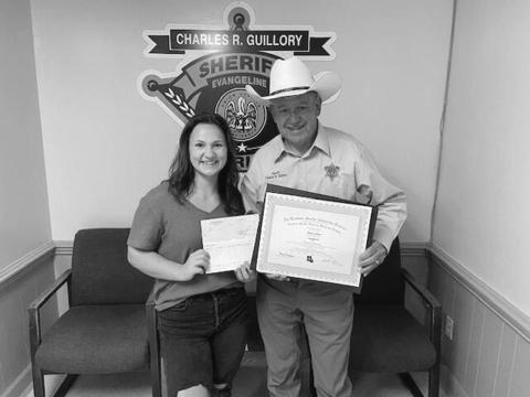Ricki Lafleur (left) is pictured with Evangeline Parish Sheriff Charles Guillory after receiving an academic scholarship from the Louisiana Sheriff’s Scholarship Program. (Photo courtesy of EPSO) 