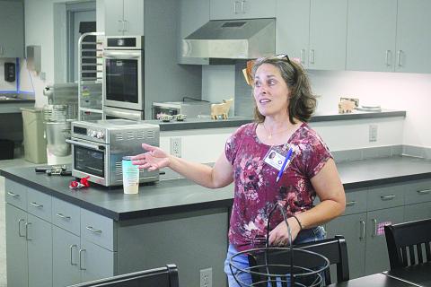 Erica L. Fontenot, assistant principal of Evangeline Reimagine Academy, shows off the school’s test kitchen and culinary area during an open house on Tuesday, August 10. (Gazette photo by Tony Marks)
