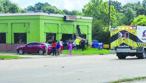 Car runs into vacant building