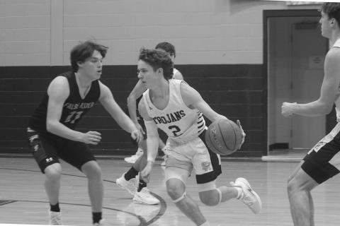 Hayden Deshotel (2) drives toward the net in Sacred Heart’s 73-31 win over False River to begin district play. (Gazette photo by Rhett Manuel)