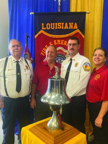 SUPPORTING FUSILIER - Three local firefighters were in attendance at Kyle Fusilier’s graduation ceremony from LFETA. Pictured (left to right) are Acadia-Evangeline Fire District Fire Chief Greg Savoy, Mike Putnam of the Basile Volunteer Fire Department and father-in-law of the graduate; Fusilier; and Heather Putnam-Lantz, member of the Basile Fire Department, the Basile Town Clerk, and sister-in-law of Fusilier.