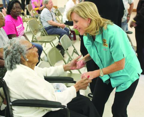 AUGUST 21, 2016 - First Lady of Louisiana Donna Edwards talks to 85-year-old Pearl Godfrey, of Ville Platte, at the Ville Platte Civic Center on Friday. Edwards stopped by Ville Platte to talk to residents affected by the historic flooding. (Gazette photo by Raymond Partsch III)