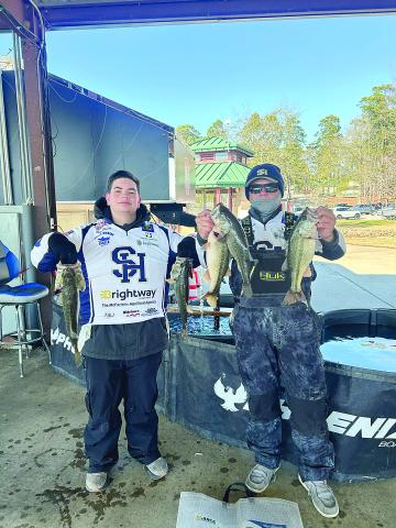 Nixon Doucet (left) and Brecken Figueiredo (right) show off their fish they caught while competing in the LHSAA Bass Fishing Region I tournament at Toledo Bend. The two Sacred Heart anglers qualified for the state tournament. Also qualifying for state were Austin West and Jake Ardoin. (Photo courtesy of Kris Aguillard)