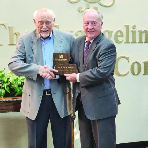 Floyd Soileau (left) is pictured as he receives a commemorative plaque for 54 years of service on The Evangeline Bank and Trust Company’s Board of Directors. He was presented the plaque by the bank’s President, Chief Executive Officer, and Chairman of the Board Randel Chapman during a ceremony held Friday, January 9. (Photo courtesy of The Evangeline Bank and Trust Company)