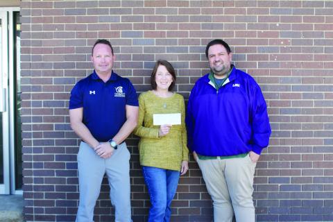Pictured from left are Lance Chapman, chief financial officer of The Evangeline Bank and Trust Company; Claudia Ortego; and Tony Marks, editor of the Ville Platte Gazette. Not pictured are Garland Forman and Richard Guillory. (Gazette photo by Kathy Longino)