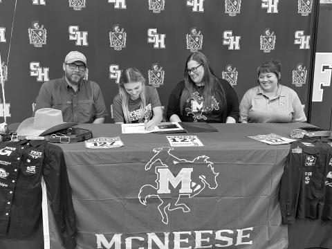 Pictured from left are Doug Fruge; Sidney Fruge, a Sacred Heart student who signed with the McNeese rodeo team; Rebecca Fruge, and Sacred Heart Rodeo Coach Stephanie Fontenot. (Gazette photo by Heather Bogard)