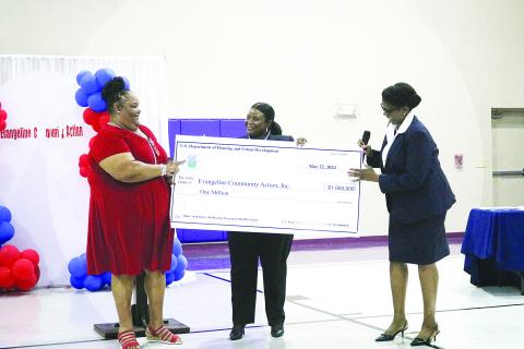 Executive Director of Evangeline Community Action Agency , Inc., Carleen Bellard (left) accepts a $1 million grant from HUD Office of Lead and Hazard Control and Healthy Homes Dr. Taneka Blue, and HUD New Orleans field office director Sylvia Purvis (right). (Gazette photo by Tony Marks)