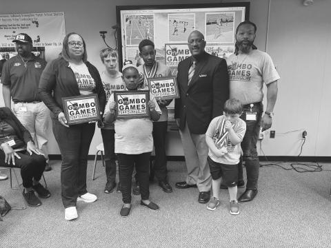 GUMBO GAMES PARTICIPANTS RECOGNIZED - Several Evangeline Parish students recently competed in the Gumbo Games held at Northwestern University in Natchitoches. Students from throughout the school district placed in the various competition categories. They were recognized at the school board meeting held October 18, Shown above, from left, are Coach Dot Doulet; Colby Lasage, Donalieh Ardoin, Damarion Freeman, Superintendent Darwan Lazard, Reid Latour and Coach Jorie Randle. (Gazette photo by Heather Bogard)