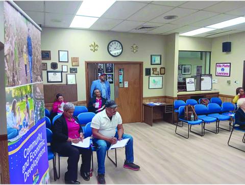 Participants, including Ville Platte Mayor Ryan LeDay Williams (center), listen to a presentation during a recent heirs’ property training event in Ville Platte. (Photo provided by the Southern University Ag Center)