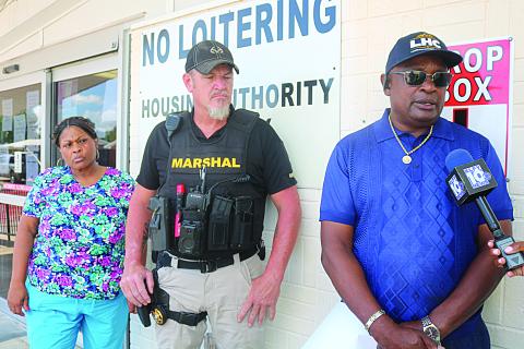 Arthur Sampson (right), chairman of the Ville Platte Housing Authority board, speaks during a press conference held Tuesday, July 9. Also pictured are Ville Platte Chief Deputy City Marshal Nik Cormier (center) and board member Lena Charles (left), who represents the tenants. (Gazette photo by Tony Marks)