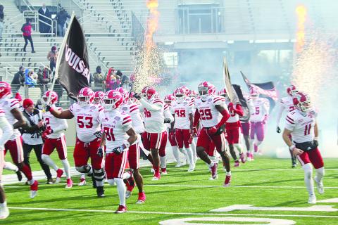 The Ragin Cajuns of the University of Louisiana Lafayette take the field in Shreveport before clashing against the University of Houston Cougars in a 23-16 loss in the Radiance Technologies Independence Bowl. (LSN photo by Tony Marks)