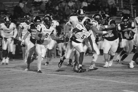 Ville Platte running back Jakahalen Slaughter (6) looks to turn the corner for a running lane during the first half of the Bulldogs road loss in District 4-3A. (Gazette photo by Rhett Manuel)