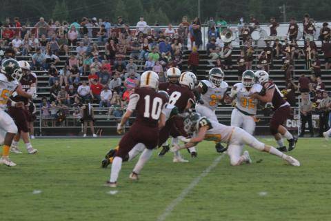 Caden Lejeune (13) lunges forward as he tries to make a tackle against a player from Grant in a Mamou game earlier the season. Lejeune and the rest of the Green Demons look to get their first non-forfeited win of the season at home tomorrow night against Port Barre. (Gazette photo by Tony Marks)