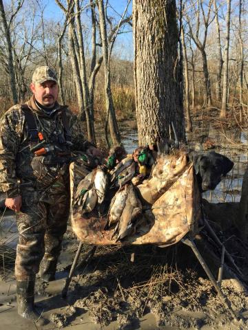 Luke Deville is pictured with ducks and his trusted hunting dog while on a recent hunting trip. To Deville, hunting keeps the bonds together among family and friends. (Photo courtesy of Luke Deville)