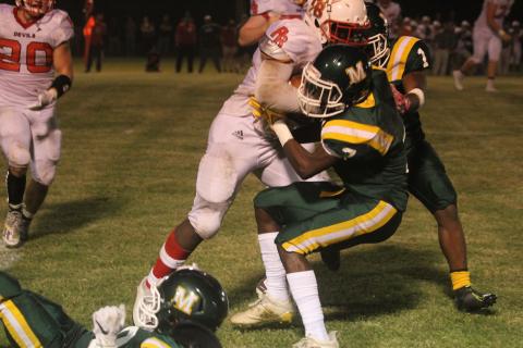 Jerez Edwards (7) makes a stop in Mamou’s game against Port Barre earlier this season. Edwards and the rest of the Green Demons dropped the regular season finale to Iota Friday. (Gazette photo by Tony Marks)