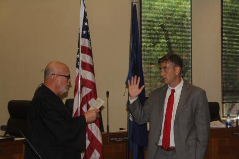 Justin Bo West (right) takes the oath of office as assistant district attorney from his second cousin, the honorable Judge Chuck West of the 13th Judicial District Court Division B. (Gazette photo by Tony Marks)