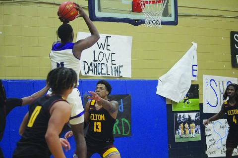 Ville Platte’s Montavis Seraille (4) goes up for a basket in the Bulldogs’ game against Elton during the Turkey Tournament at Sacred Heart. (Gazette photo by Rhett Manuel)