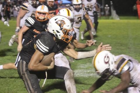 Pine Prairie’s Bryce Ardoin fights for extra yardage on a completion from Branson Fontenot  (Gazette photo by Tony Marks)