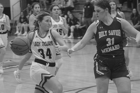 Taylor Darbonne (34) surges past a Holy Savior Menard defender on her way to the goal this past Monday night. (Gazette photo by Rhett Manuel)