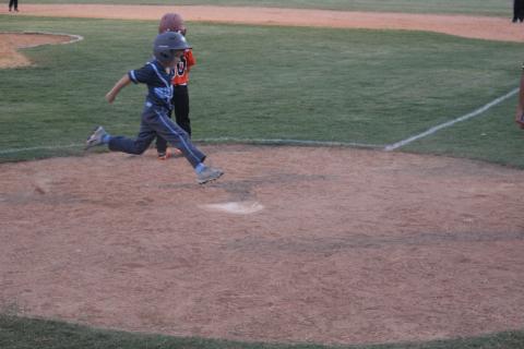 Graham Fontenot (4) scores a run for the Ville Platte West All-Stars against Pine Prairie North. (Gazette photo by Rhett Manuel)