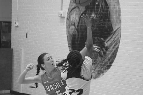 Vandryua Wilson (22) goes up for a rebound against a Basile Lady Bearcat in the opening game of the parish tournament. (Gazette photo by Rhett Manuel)