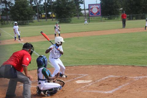 With Deion Jones (2) standing 60 feet away on third base, I’Jai Lewis (30) watches a pitch cross home plate for a ball. Jones and Lewis are members of the Super 10 All-Stars from Ville Platte that took home the District 7 championship. (Gazette photo by Rhett Manuel)