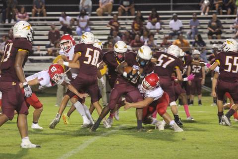 Basile’s Christian Bergeron (73) makes a tackle on Elton’s Shermon Bellow (20). Later in the game, Bergeron forced a fumble and returned it 40 yards for a touchdown. (Gazette photo by Tony Marks)