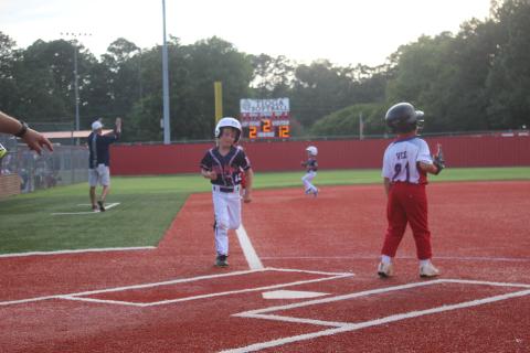 Ville Platte East t-ball All-Star Levi Welch glides into home plate in a state tournament game over the weekend. Ville Platte East managed a 5-2 record in Tioga, qualifying the team to play in the upcoming World Series. (Gazette photo by Rhett Manuel)