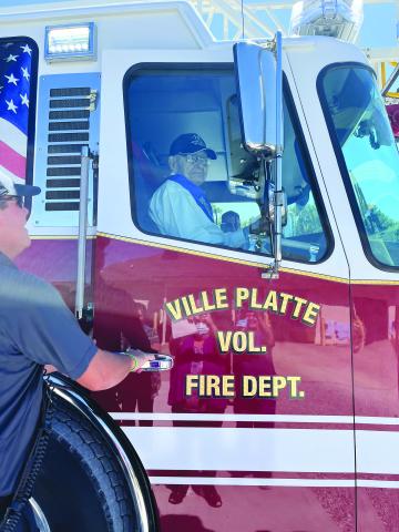 To help Alvin Soileau celebrate his birthday, members of the Ville Platte Fire Department took him for a ride in one of the fire trucks. See more photos on Page 1B. (Gazette photo by Heather Bogard)