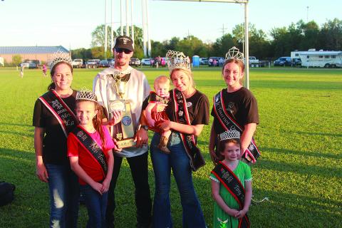 Alex Haller accepts his Tournoi championship trophy from members of the 2021 Tournoi Royalty.