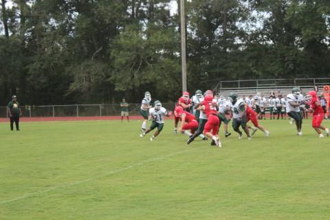 Mamou’s Keontez Campbell (21) tries to find a running lane against a stingy Basile defense in the teams’ scrimmage held Thursday, August 18. (Gazette photo by Rhett Manuel)