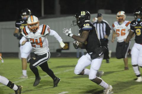 Pine Prairie’s Laine Elliott (24) tries to keep pace with Church Point’s Tylon Citizen (18) in the Panthers’ 64-0 road loss. (Gazette photo by Tony Marks)