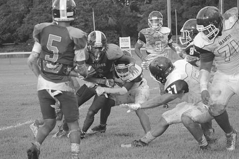 Jakahalan Slaughter (6) stays on his feet after meeting up with Mamou’s defensive unit in the jamboree. Slaughter and the rest of his Ville Platte High Bulldogs now look to defend their Tee Cotton Bowl title. (Gazette photo by Sylis Manuel)
